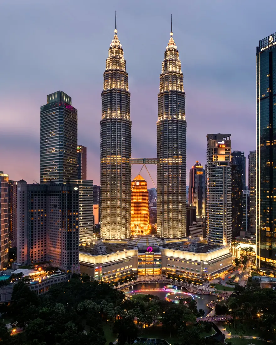The Petronas Twin Towers and the Kuala Lumpur city centre skyline at twilight